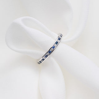 18ct White Gold Diamond And Sapphire Channel Set Half Eternity Ring