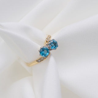 18ct Yellow Gold Blue Topaz And Diamond Toi Et Moi Crossover Ring